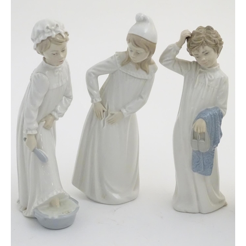 77 - Four Nao figures to include 'Boy with Slippers', model no. 232, 'Boy with Books', model no. 233, 'Gi... 