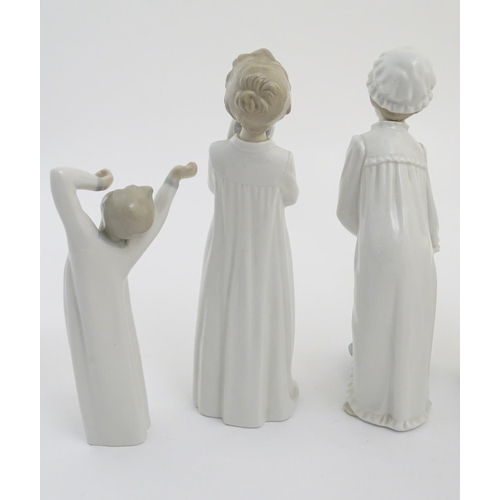 77 - Four Nao figures to include 'Boy with Slippers', model no. 232, 'Boy with Books', model no. 233, 'Gi... 