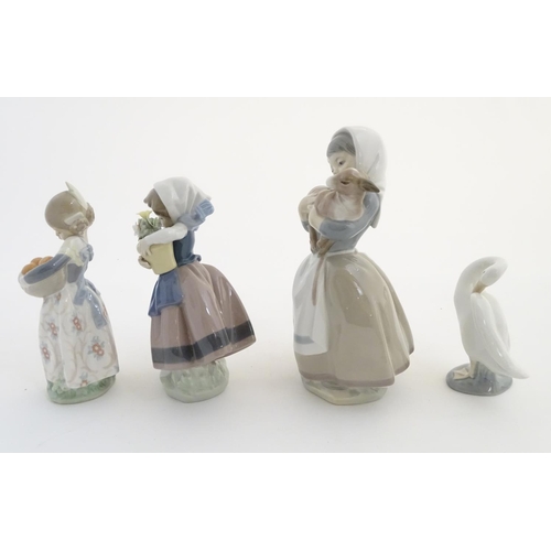 78 - Three Lladro figures, comprising 'Spring is Here' no. 5223, a girl holding a flower pot, 'Valencia G... 