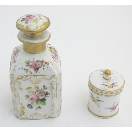 80 - Two Continental lidded ceramic containers; a small pot decorated with hand painted birds, fruit and ... 