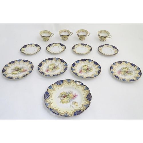 81 - An Edwardian tea set comprising, 4 tea cups and saucers, 4 side plates and a serving plate, with flo... 