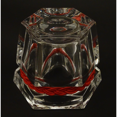 93 - Ralph Lauren : a hexagonal clear glass small bowl with plaited red strung band , 2 3/4'' high x 3'' ... 