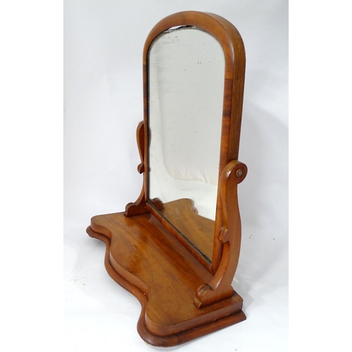 125 - A Victorian mahogany toilet mirror