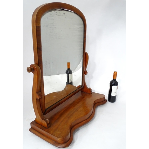 125 - A Victorian mahogany toilet mirror