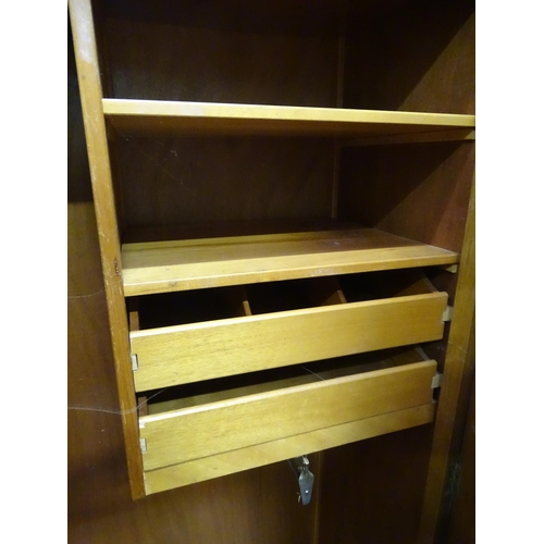 129 - E. Gomme, light oak wardrobe (2 door)