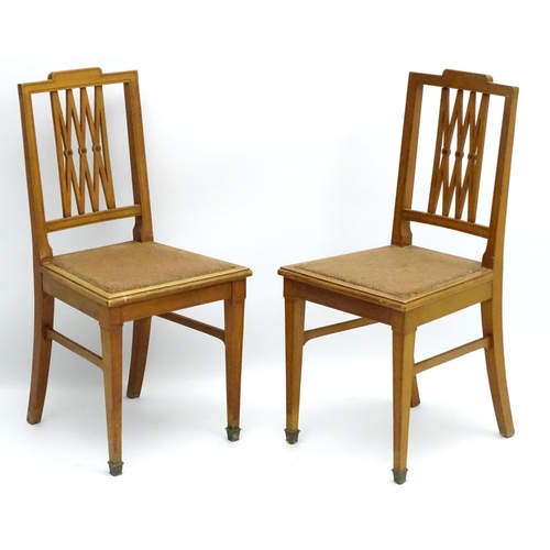 130 - A pair of early 20thC satinwood side chairs having ebonised stringing to the frame and having a pier... 