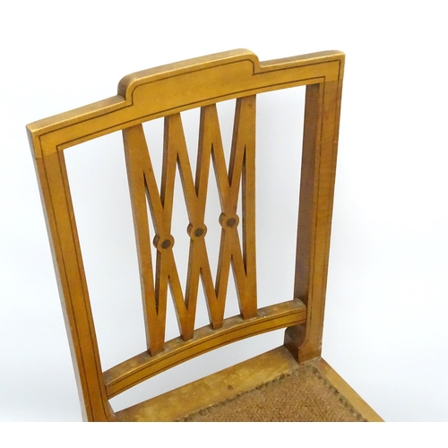 130 - A pair of early 20thC satinwood side chairs having ebonised stringing to the frame and having a pier... 