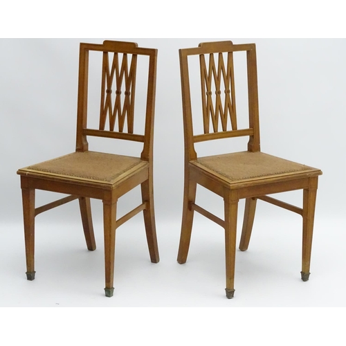 130 - A pair of early 20thC satinwood side chairs having ebonised stringing to the frame and having a pier... 