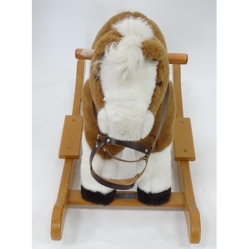 150 - A upholstered rocking horse