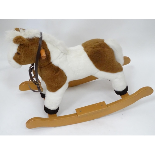 150 - A upholstered rocking horse