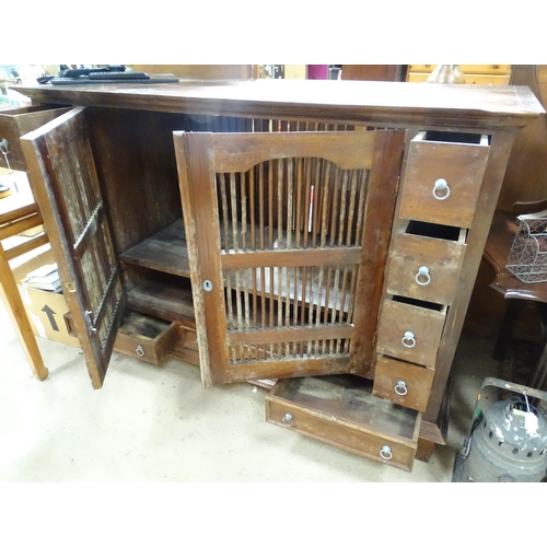 196 - A large oriental cabinet with two ventilated central drawers