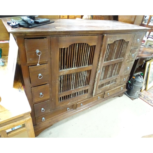 196 - A large oriental cabinet with two ventilated central drawers