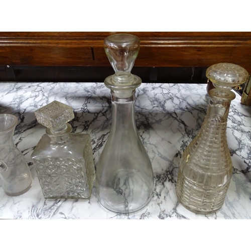 220 - A set of 3 graduated carafes, together with 3 assorted glass decanters