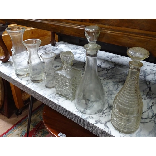 220 - A set of 3 graduated carafes, together with 3 assorted glass decanters