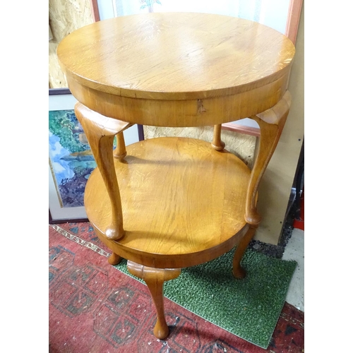 225 - A pair of oak circular occasional tables.