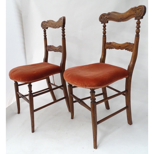 226 - A pair of continental carved chairs