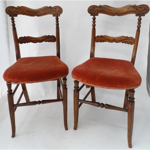 226 - A pair of continental carved chairs