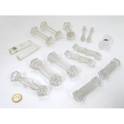 239 - Knife / Spoon rests : 14 assorted shaped glass rests , the largest measuring 4 1/4'' wide .