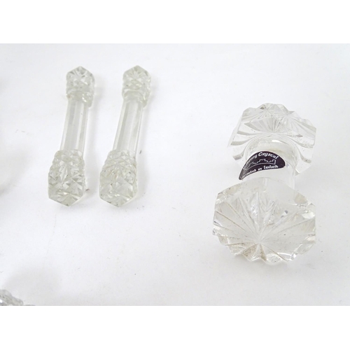 239 - Knife / Spoon rests : 14 assorted shaped glass rests , the largest measuring 4 1/4'' wide .