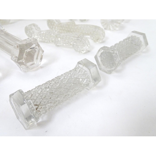 239 - Knife / Spoon rests : 14 assorted shaped glass rests , the largest measuring 4 1/4'' wide .