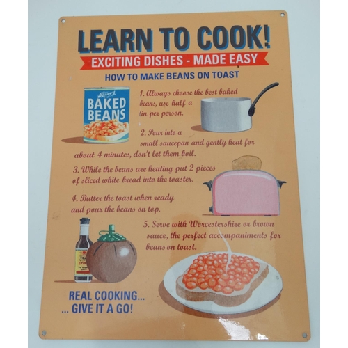 262 - A 21stC metal sign, 15 3/4'' x 11 3/4'' wide, 'Learn to Cook' 'Exciting dishes-Made easy'