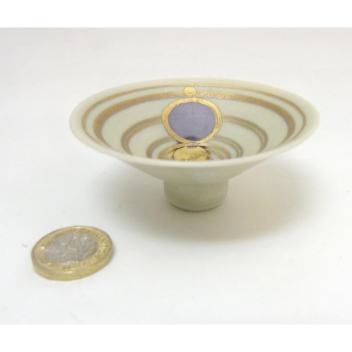 288 - Studio Pottery: A small apsed bowl by Glynn Hugo, depicting aligned planets within circle designs in... 