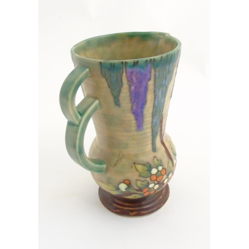 295 - An Art Deco Crown Devon Fieldings 'Mattita' double handled vase / jug with tube lined and drip glaze... 