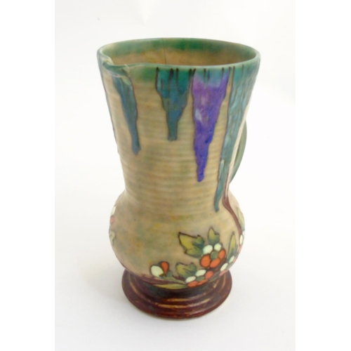 295 - An Art Deco Crown Devon Fieldings 'Mattita' double handled vase / jug with tube lined and drip glaze... 