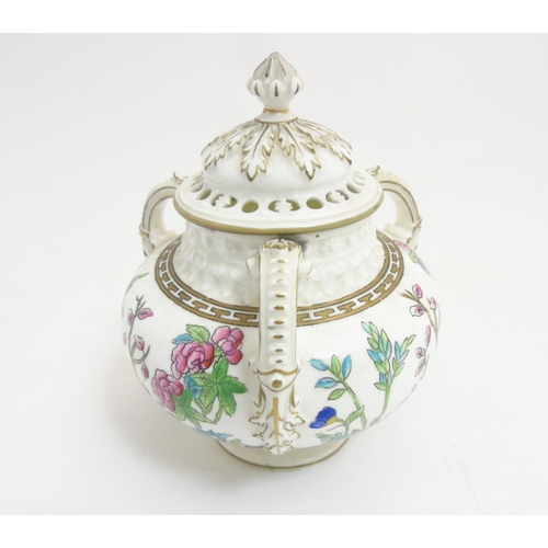 296 - A late 19thC / early 20thC lidded Coalport 3 handled pot pourri pot with cover, in ''Indian Tree '' ... 