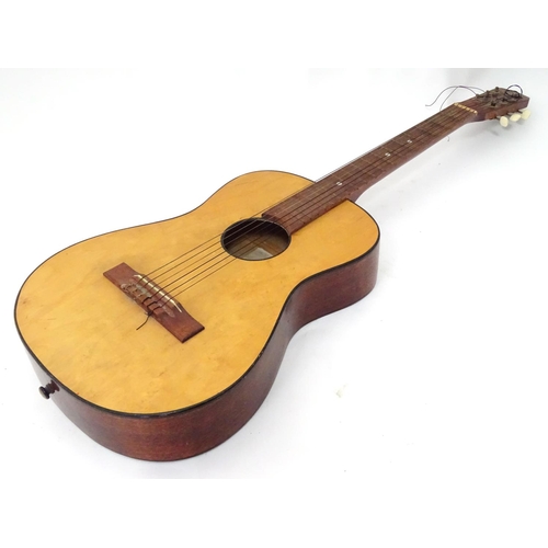 3 - A high spot, 3/4 size, nylon strung guitar