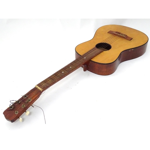 3 - A high spot, 3/4 size, nylon strung guitar