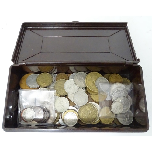 305 - A quantity of coins, to include Canadian, American, French etc. contained within a Bakelite cigarett... 