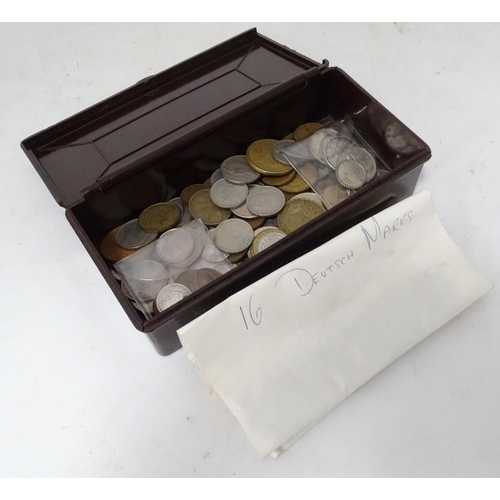 305 - A quantity of coins, to include Canadian, American, French etc. contained within a Bakelite cigarett... 