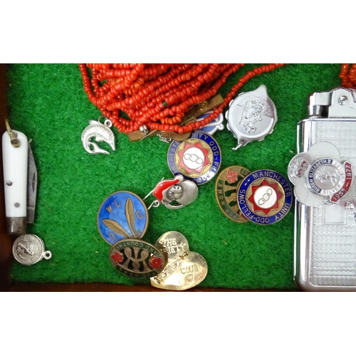 309 - A glazed display box of miscellaneous to include watches, cigarette cases, brass buttons, badges, ci... 