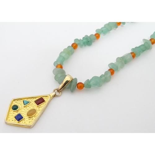 352 - A cased jadite and silvergilt necklace