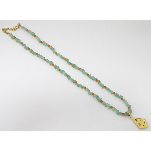 352 - A cased jadite and silvergilt necklace