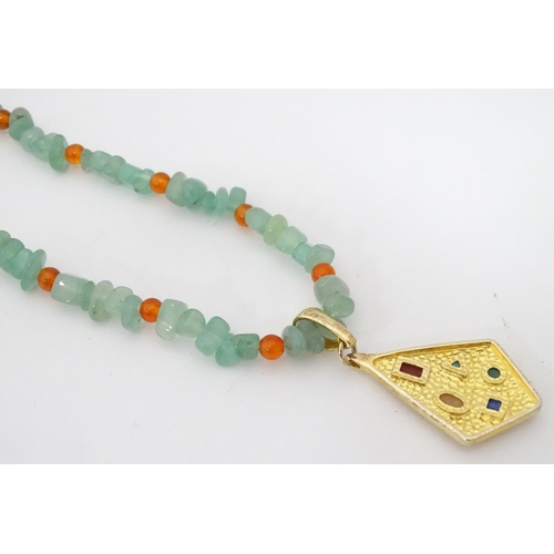 352 - A cased jadite and silvergilt necklace