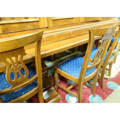 397 - A large dining room suite, comprising a dining table with 10 chairs, a sideboard, a glazed corner cu... 