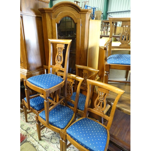 397 - A large dining room suite, comprising a dining table with 10 chairs, a sideboard, a glazed corner cu... 