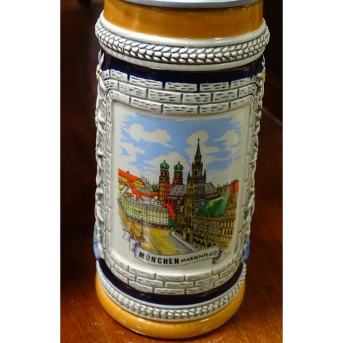 401 - A pair of German ceramic Stein mugs, with Munich decoration. Stamped under Gurz