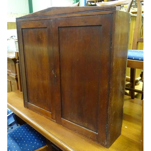 403 - A mahogany wall cupboard