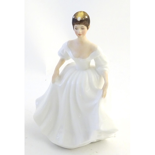 404 - Four Royal Doulton & Co figures of ladies to include Elaine modelled by Peggy Davies (HN2791), Soire... 