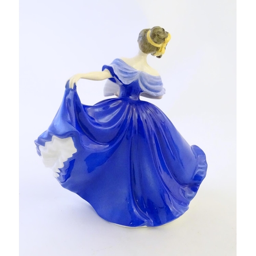 404 - Four Royal Doulton & Co figures of ladies to include Elaine modelled by Peggy Davies (HN2791), Soire... 