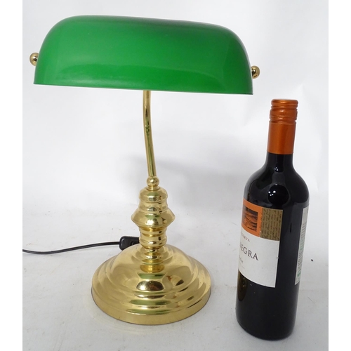 414 - A brass desk lamp with a green glass shade