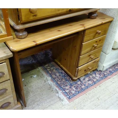 415 - Pine four drawers chest of drawers together with a pine desk (2)