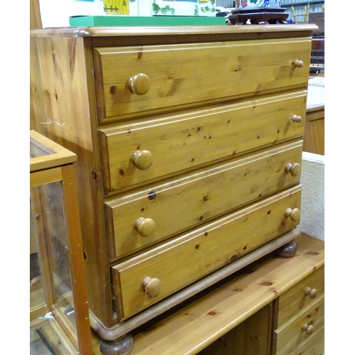 415 - Pine four drawers chest of drawers together with a pine desk (2)