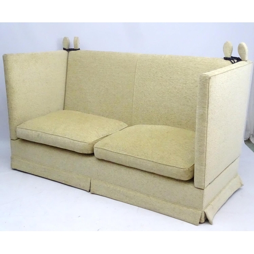 416 - Two Knole sofas: an early 21st oatmeal upholstered (generous) two seat settee with rope ties. 62'' w... 