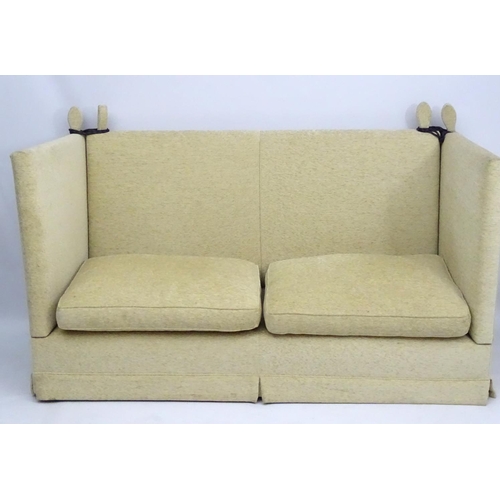 416 - Two Knole sofas: an early 21st oatmeal upholstered (generous) two seat settee with rope ties. 62'' w... 