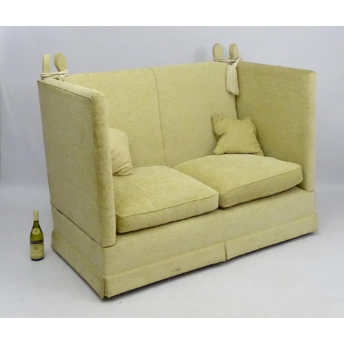 416 - Two Knole sofas: an early 21st oatmeal upholstered (generous) two seat settee with rope ties. 62'' w... 