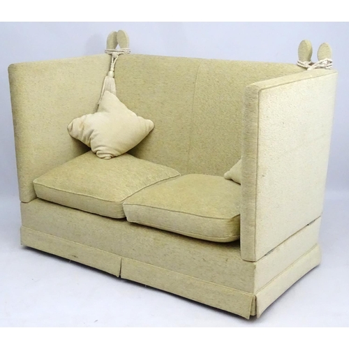 416 - Two Knole sofas: an early 21st oatmeal upholstered (generous) two seat settee with rope ties. 62'' w... 